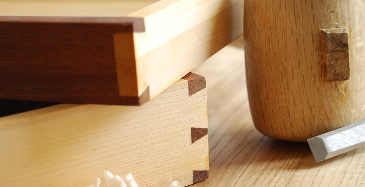 Details of a dovetailed joint on two little drawers